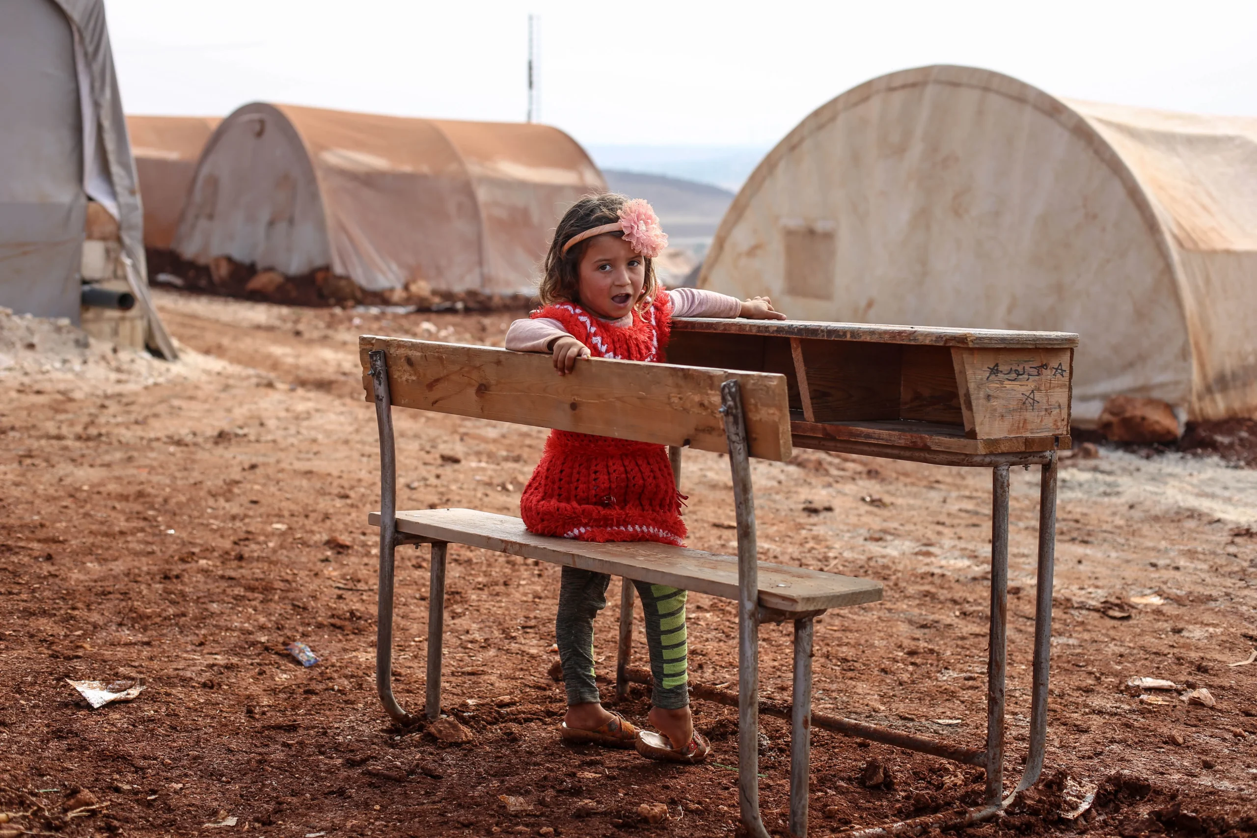 A girl alone with the school desk.