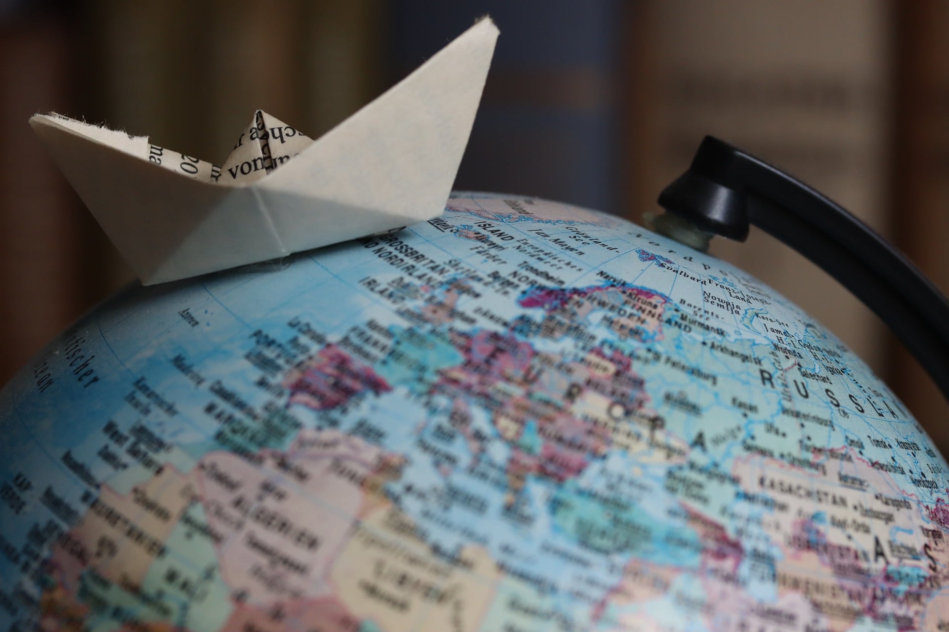 A boat on the globe of the world.