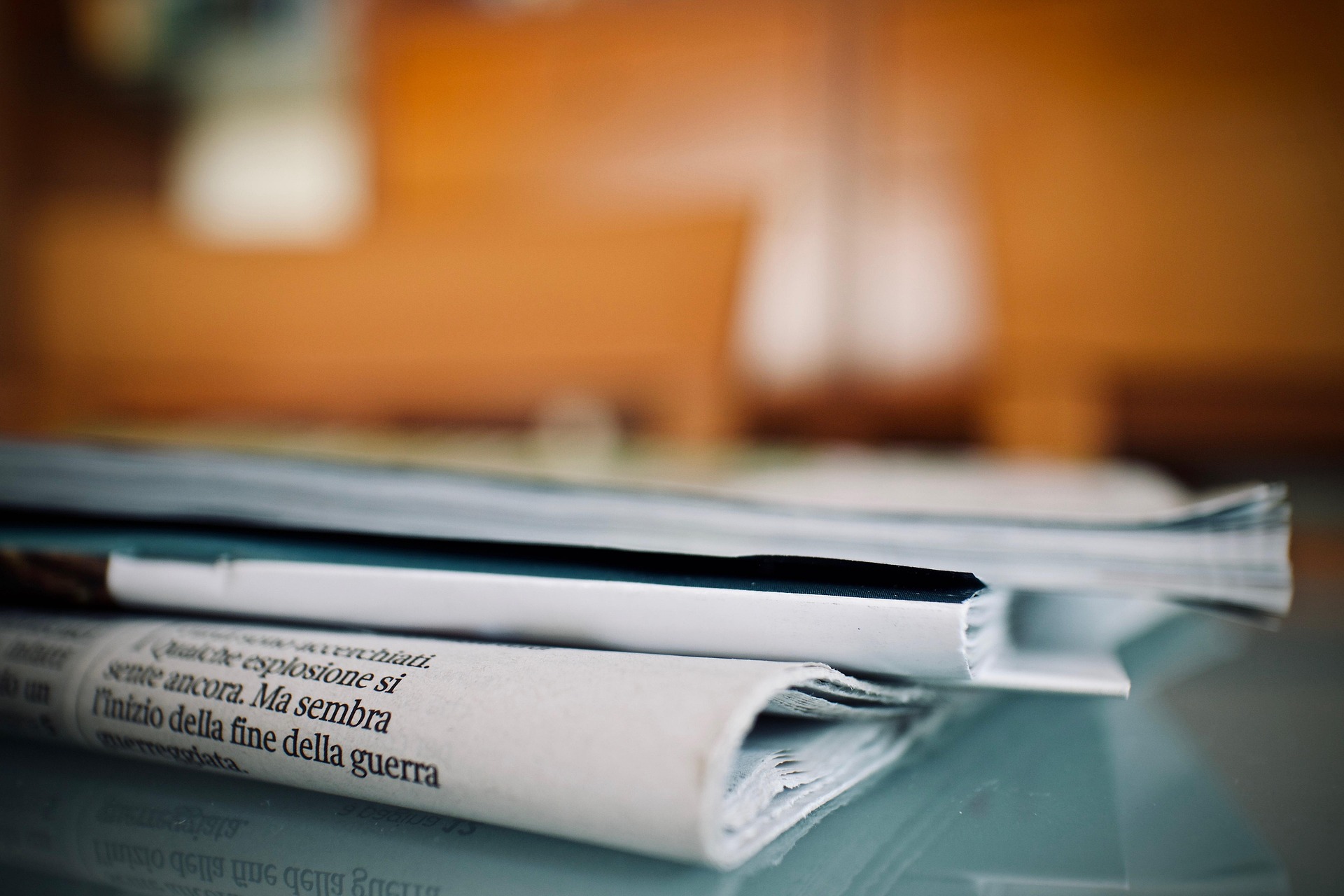 A bundle of newspapers lying on the table.