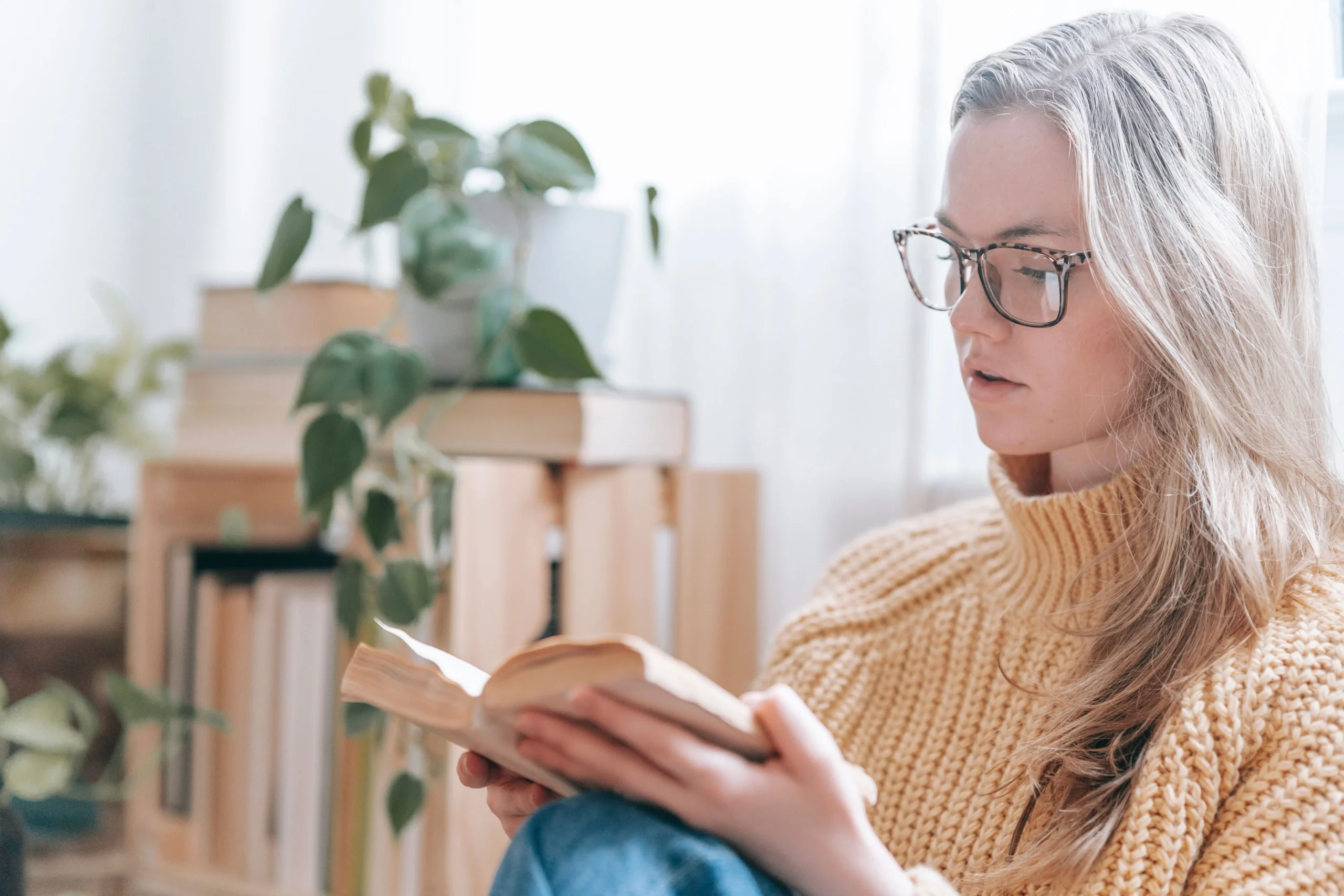 A girl is studying with glasses