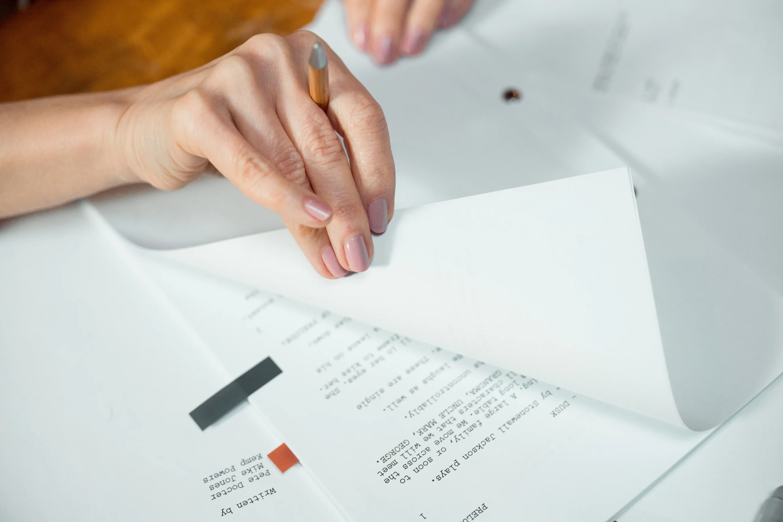 A girl is checking papers.