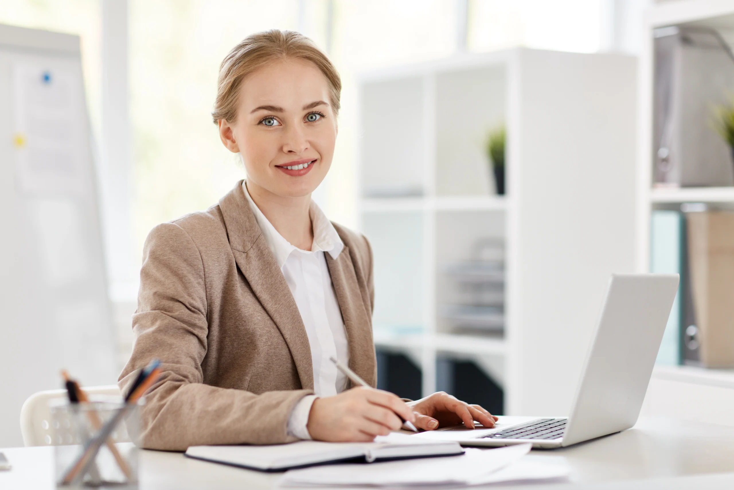 A girl in office dealing with the office files.