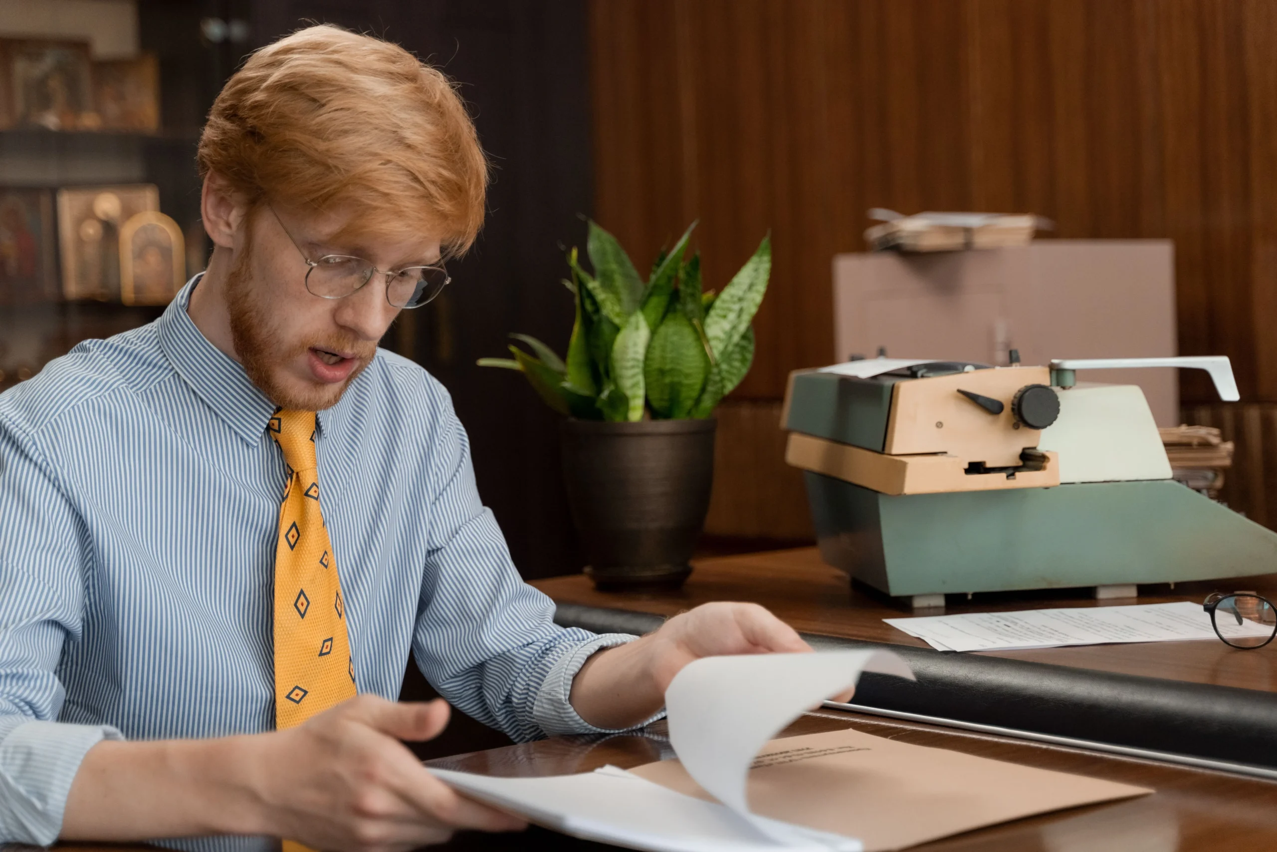 A man dealing with the office files.