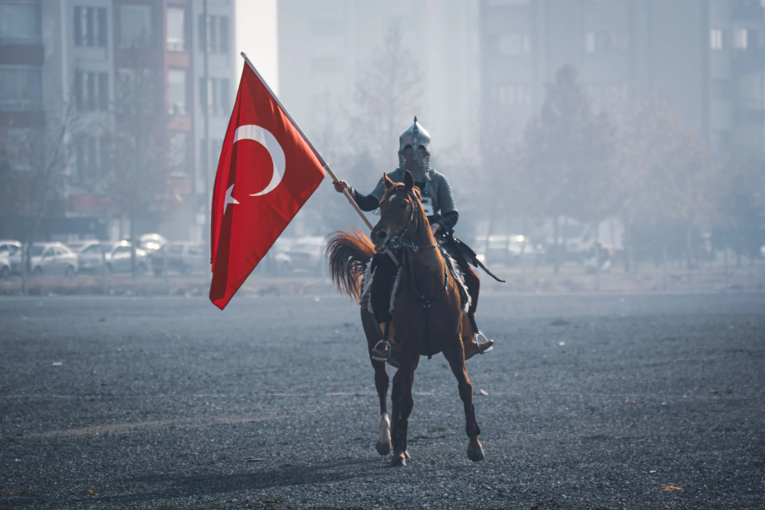 A soldier holding a Turkey flag.