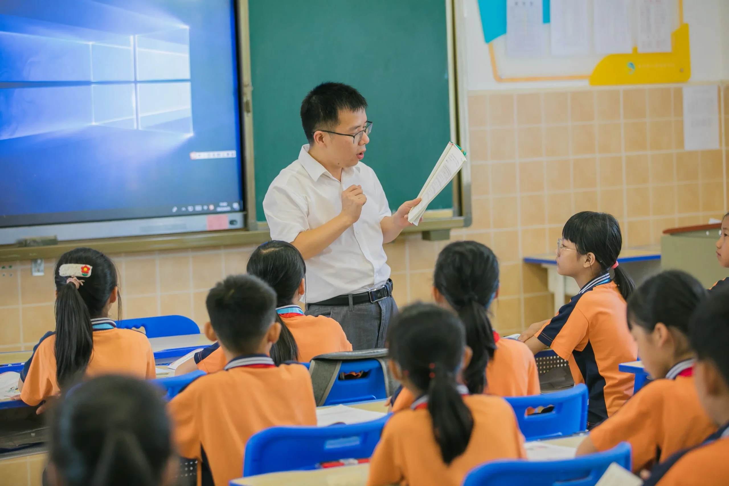A teacher is teaching the students.