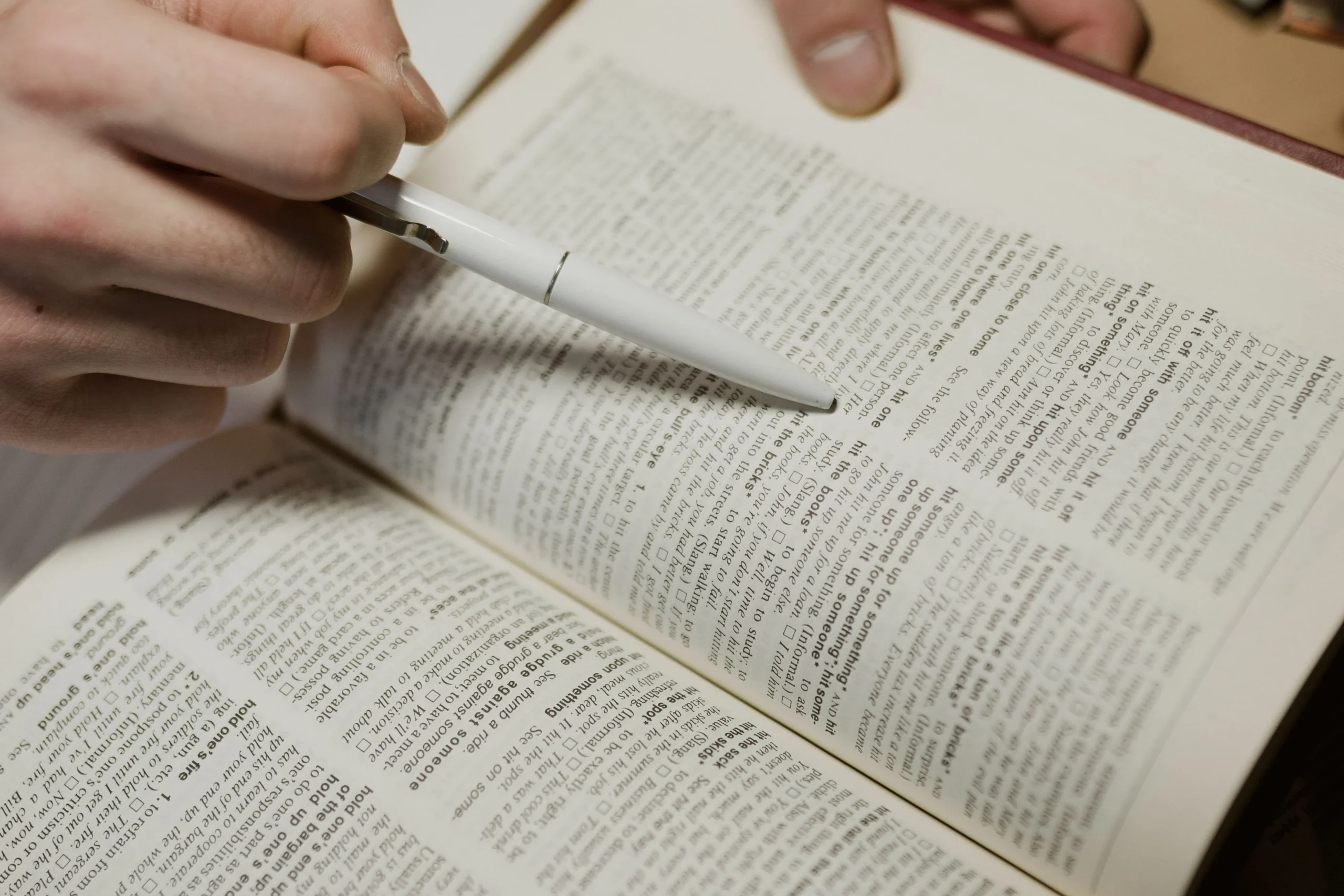 A dictionary is being reading.