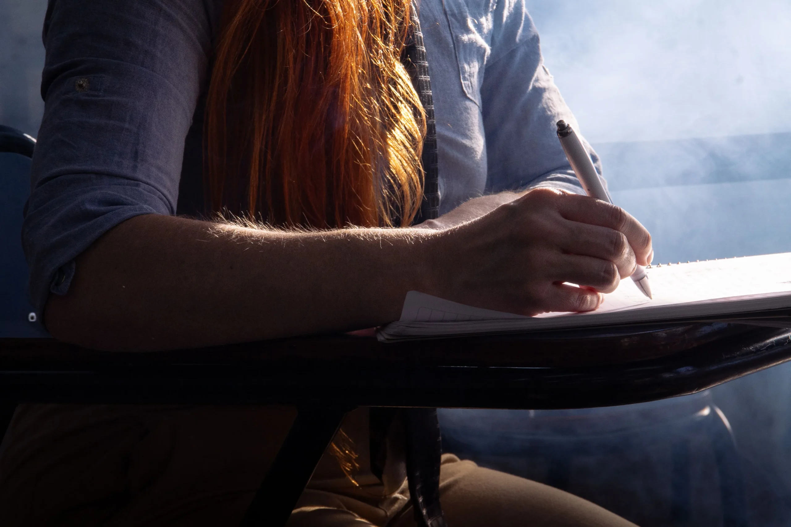 A girl is sitting in her exams.