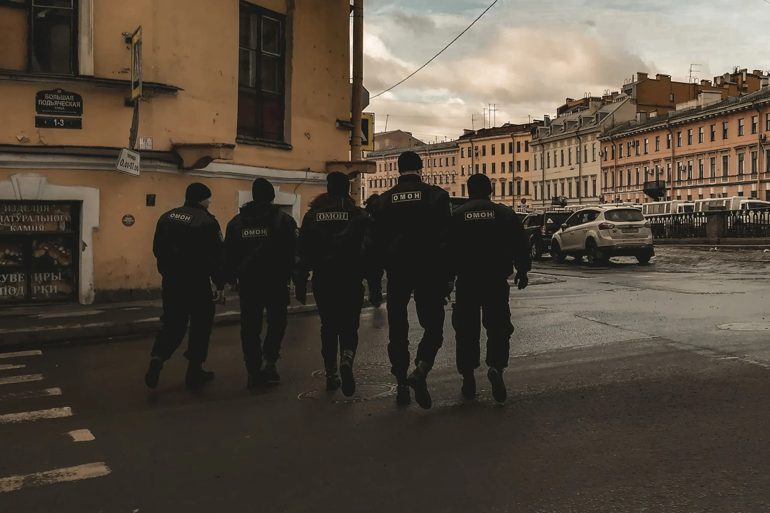 Police agents are walking down the road.