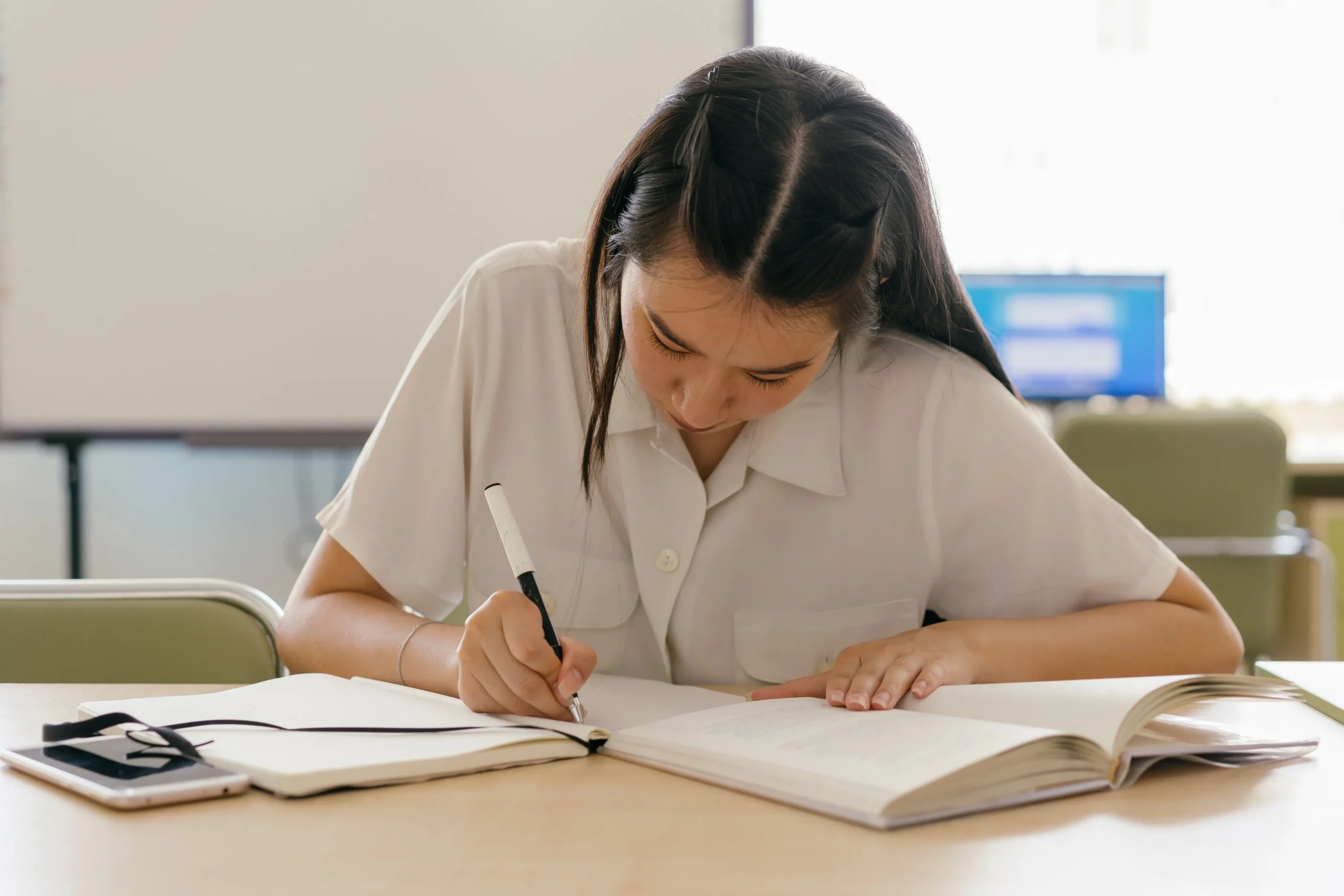 A girl is studying.