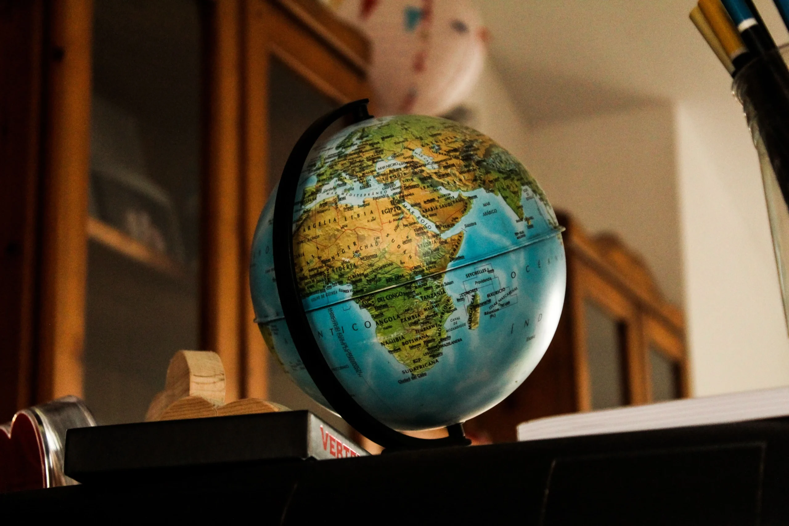 A world globe is placed on a table.